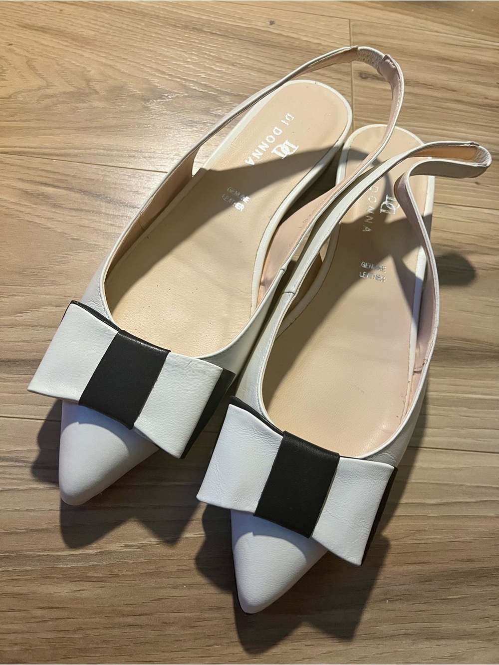Beige and black sling back flats